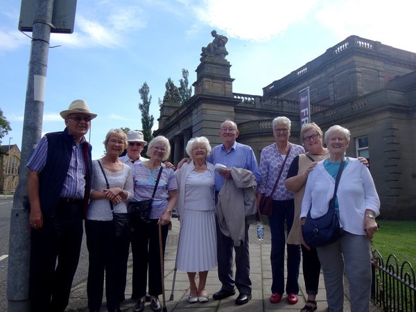 A mixed group of nine pensioners stood outside the Shipley Art Gallery in Gateshead on a fine day